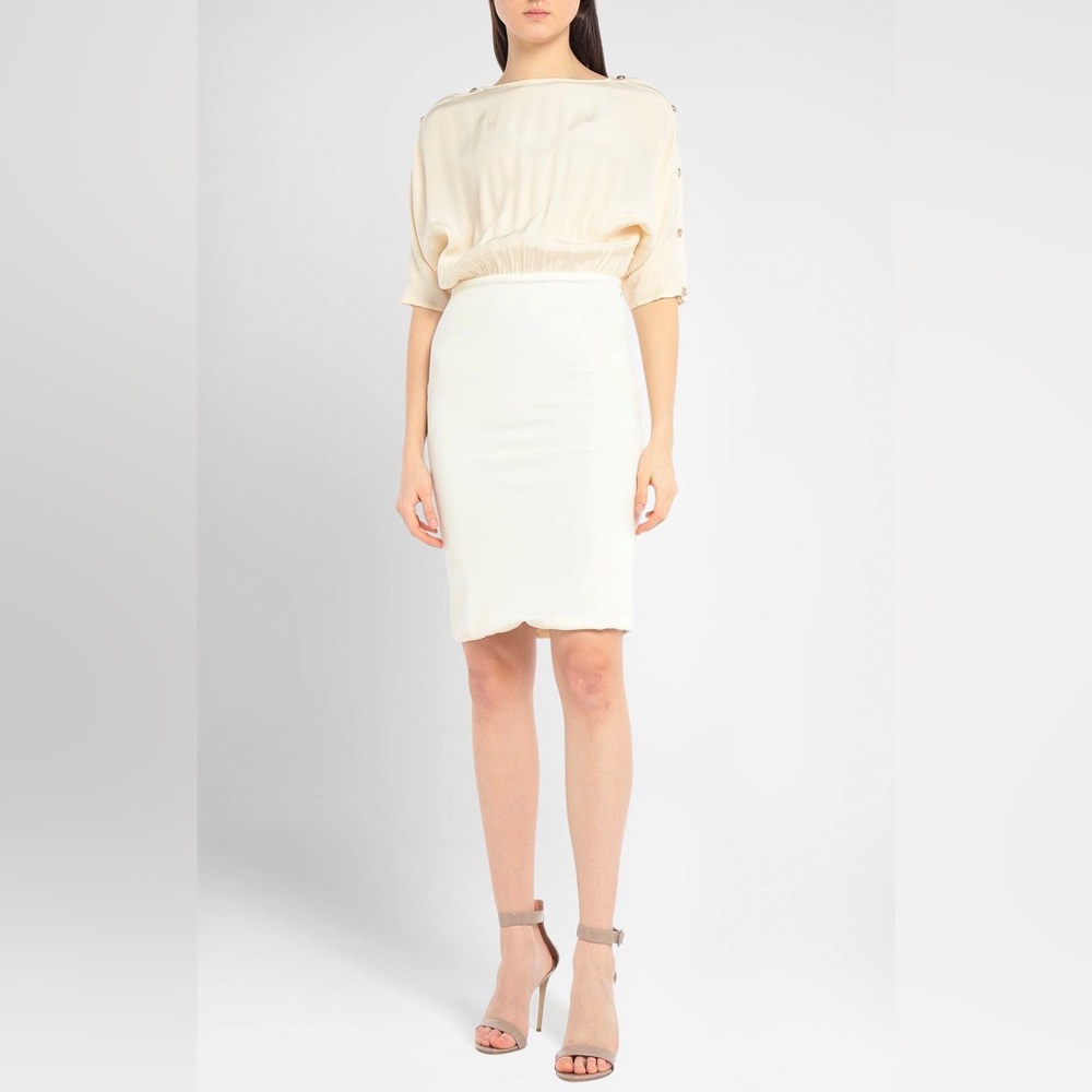 Versace ivory colored cocktail dress with Medusa detailing on shoulders.